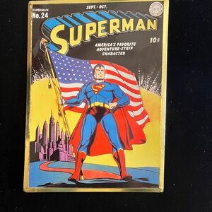 DC Comics Embossed Superman No. 24 Book Cover Art with Red, Blue, and Yellow